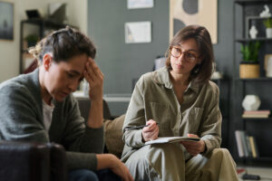 A woman participates in therapy for addiction and trauma recovery.